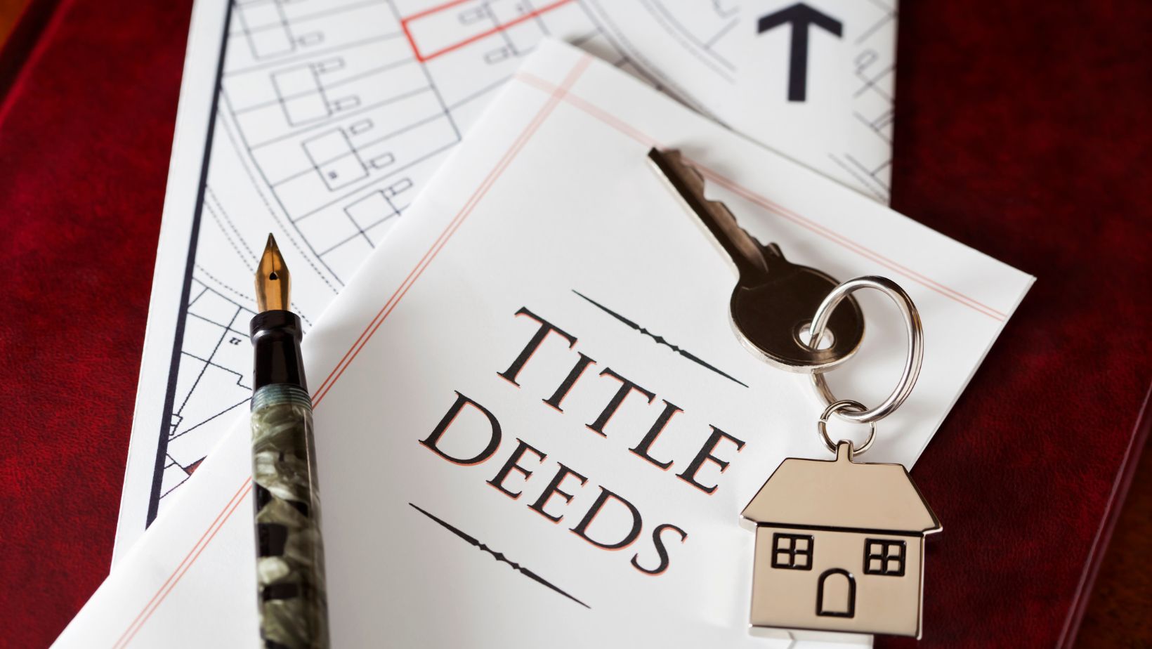 Title deed document and house key